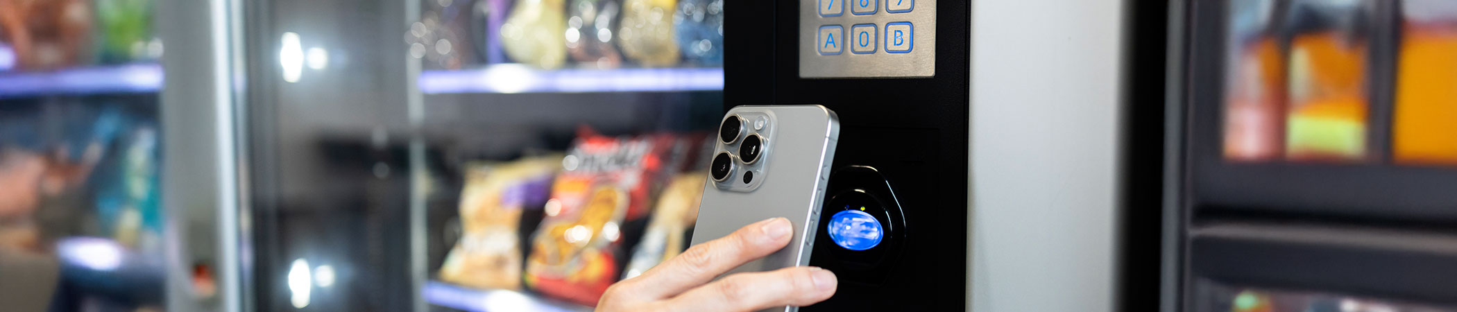 close up of someone using a vending machine