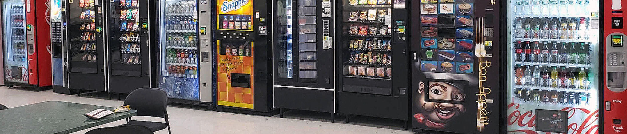 a line up of vending machines